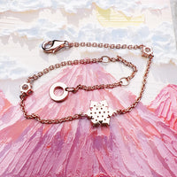 Pulsera de oro rosa de copos de nieve
