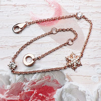 Pulsera de oro rosa de copos de nieve