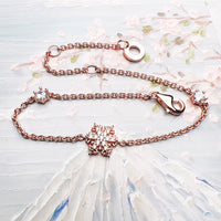 Pulsera de oro rosa de copos de nieve