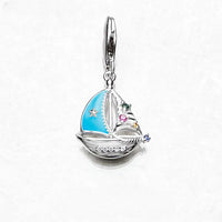 Encanto de bote de vela azul