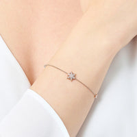 Pulsera de oro rosa de copos de nieve
