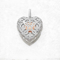 A sterling silver heart-shaped locket pendant with intricate designs and a zircon stone in the center.